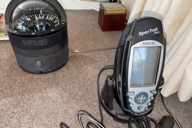 Slide: The Image of Compass and GPS device on 1980 Roughwater MOTOR SAILER boat interior. - 8