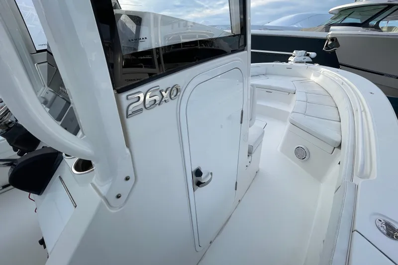 Slide: The Image of 2020 Regulator 26XO boat interior with seating and console, showcasing sleek design. - 18