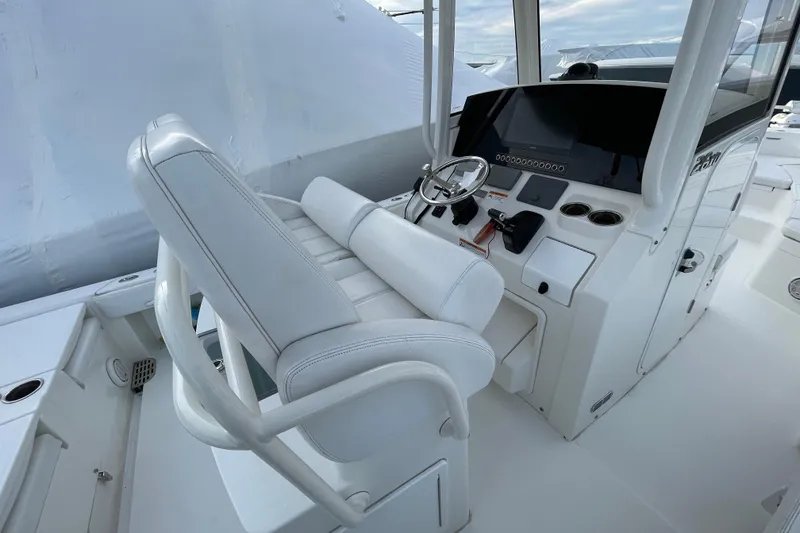 Slide: The Image of 2020 Regulator 26XO boat interior with white seating and modern dashboard. - 21