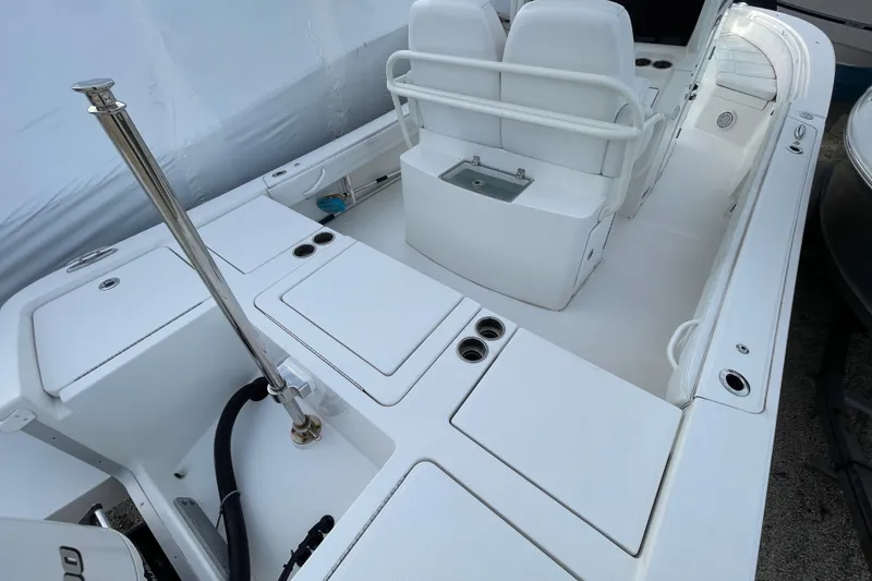 Slide: The Image of 2020 Regulator 26XO boat interior with seating and storage compartments. - 32