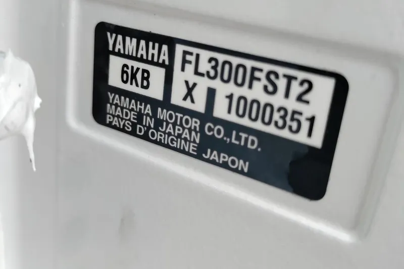 Slide: The Image of Label on Yamaha motor, model FL300FST2, made in Japan, on 2013 Jupiter 38 Cuddy. - 12