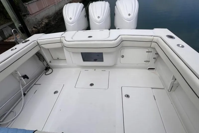 Slide: The Image of 2013 Jupiter 38 Cuddy boat deck with triple outboard engines. - 6
