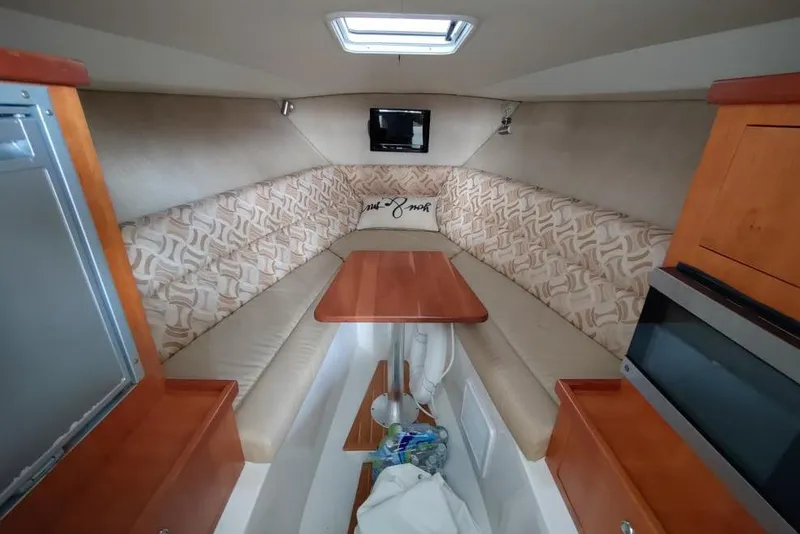 Slide: The Image of 2013 Jupiter 38 Cuddy cabin interior with seating, table, and storage. - 8