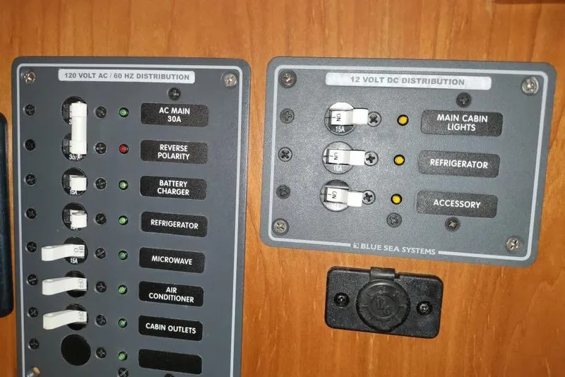 Slide: The Image of Electrical panel of a 2013 Jupiter 38 Cuddy boat with AC and DC distribution. - 9