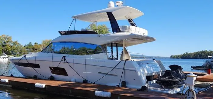 The Image of 2016 Prestige 560 luxury yacht docked at marina. - 0