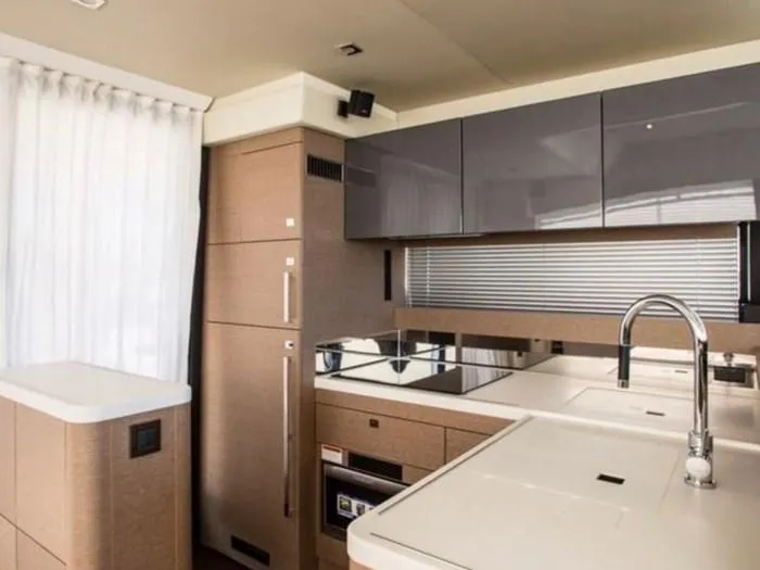 Slide: The Image of Interior of a Prestige 560 yacht, modern kitchen, 2016 model. - 11