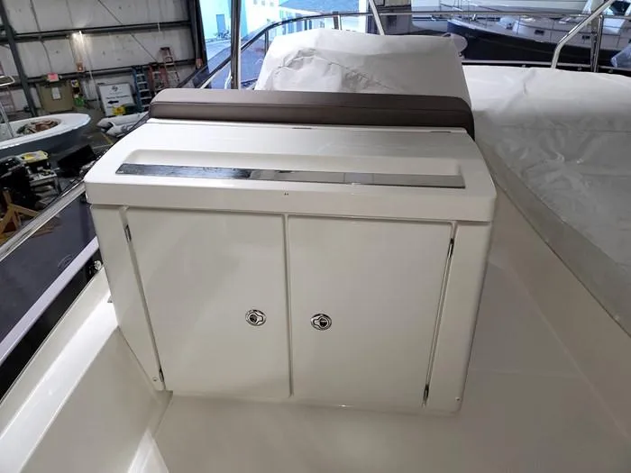 Slide: The Image of Interior view of a 2016 Prestige 560 yacht with storage compartment. - 16