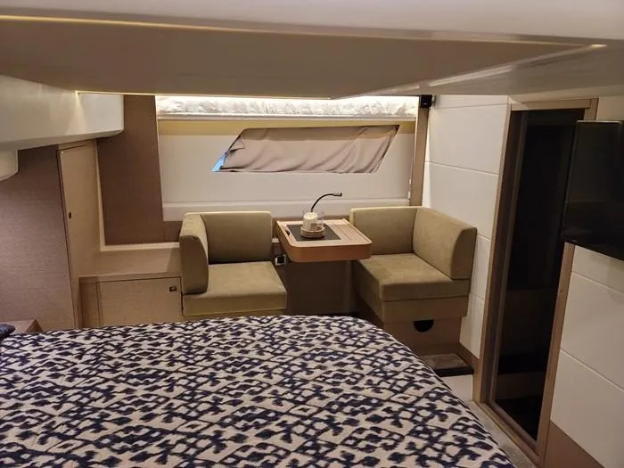Slide: The Image of Interior of a 2016 Prestige 560 yacht with cozy seating area. - 22
