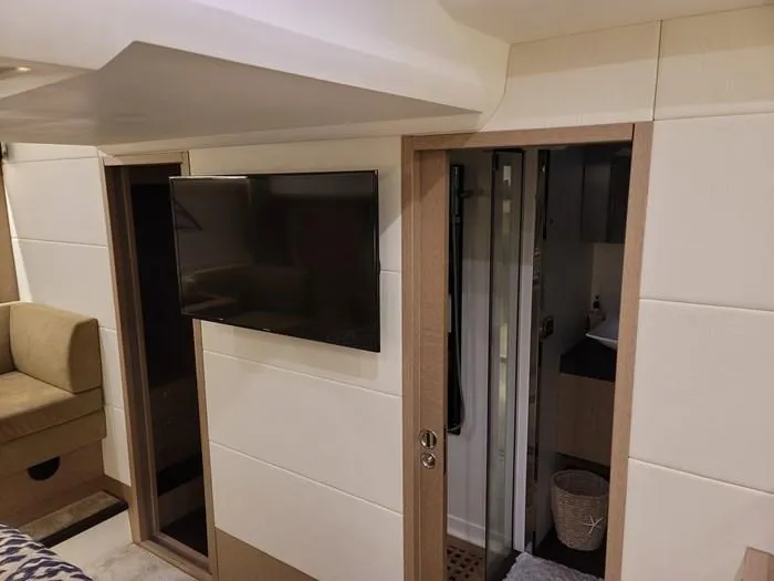 Slide: The Image of Interior of a 2016 Prestige 560 yacht with TV and bathroom. - 37