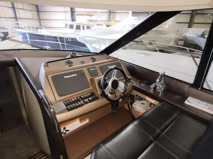 Slide: The Image of Interior view of a 2016 Prestige 560 yacht helm station. - 5