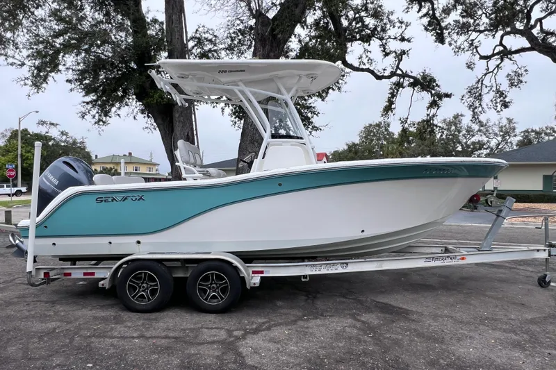 The Image of 2020 Sea Fox 228 Commander boat on trailer, parked outdoors. - 1