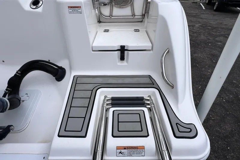 Slide: The Image of 2020 Sea Fox 228 Commander boat deck with ladder and grip handles. - 12