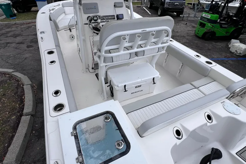 Slide: The Image of 2020 Sea Fox 228 Commander boat interior with seating and fishing rod holders. - 14