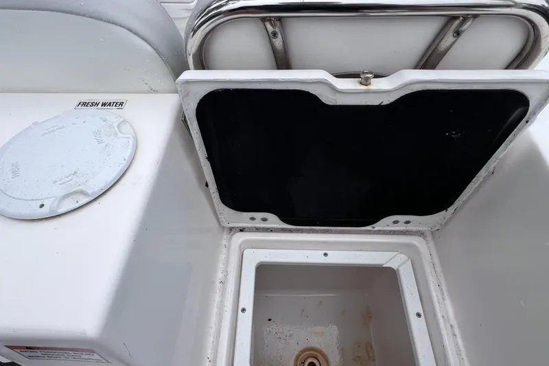 Slide: The Image of 2020 Sea Fox 228 Commander boat storage compartment with fresh water access. - 15