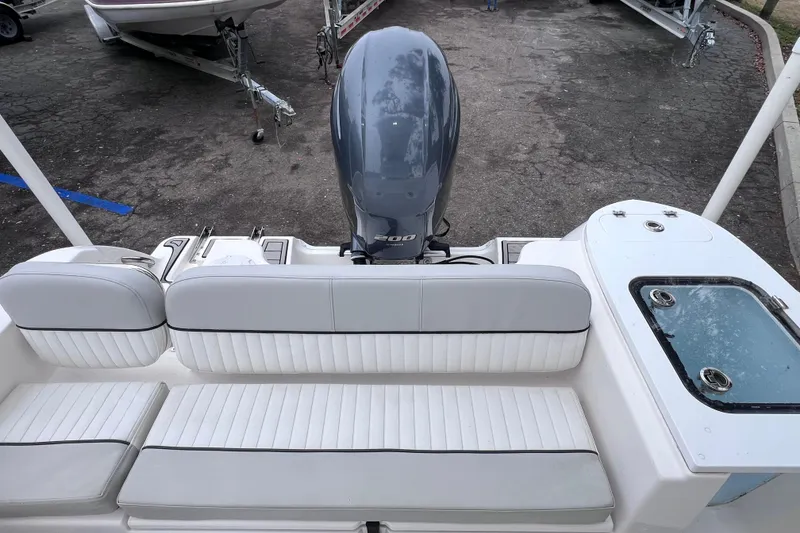 Slide: The Image of 2020 Sea Fox 228 Commander boat interior with seating and outboard motor. - 16