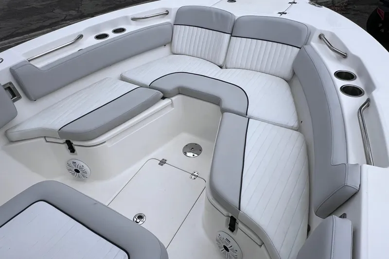 Slide: The Image of 2020 Sea Fox 228 Commander boat interior with cushioned seating and cup holders. - 37