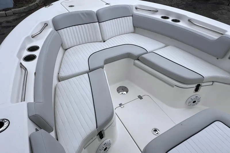 Slide: The Image of 2020 Sea Fox 228 Commander boat interior with cushioned seating and cup holders. - 38