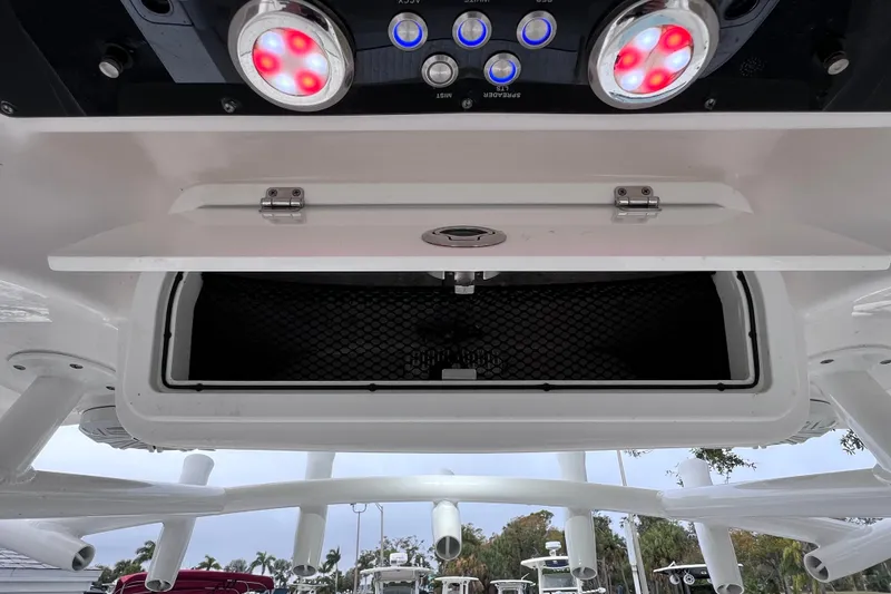 Slide: The Image of 2020 Sea Fox 228 Commander boat console with red LED lights and storage compartment. - 48