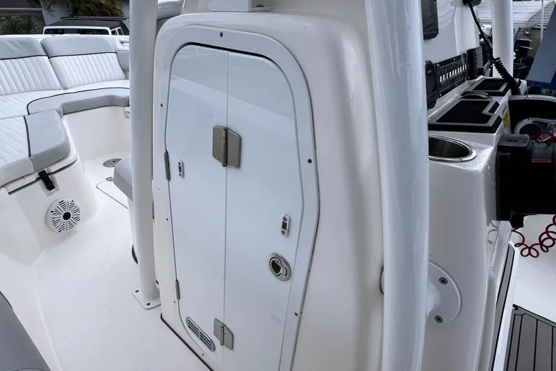 Slide: The Image of 2020 Sea Fox 228 Commander boat interior with seating and storage compartment. - 49