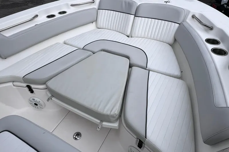 Slide: The Image of 2020 Sea Fox 228 Commander boat interior with cushioned seating and cup holders. - 51