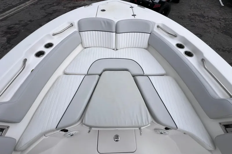 Slide: The Image of 2020 Sea Fox 228 Commander boat interior with cushioned seating and cup holders. - 52