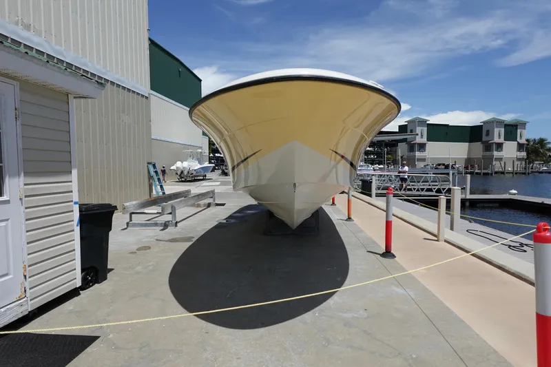 Slide: The Image of 2005 Hydra-Sports Vector 3300 CC boat docked at a marina under clear blue skies. - 12