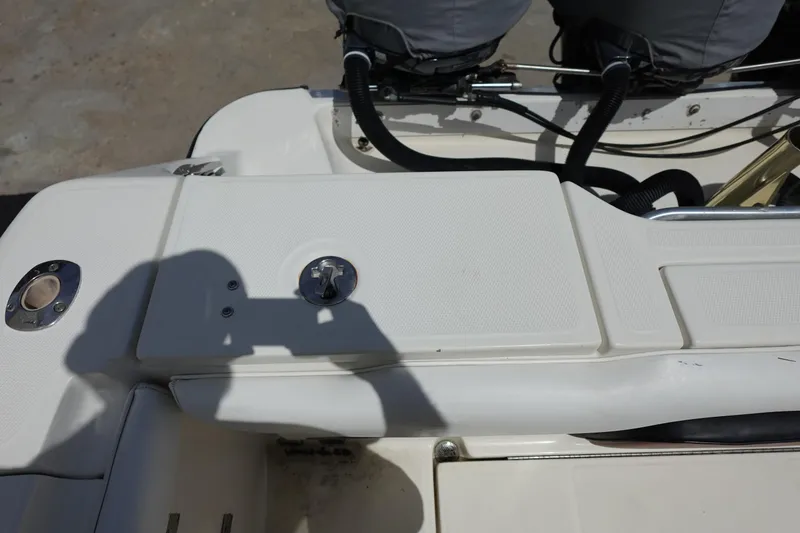 Slide: The Image of 2005 Hydra-Sports Vector 3300 CC boat deck with engine controls and shadow. - 19