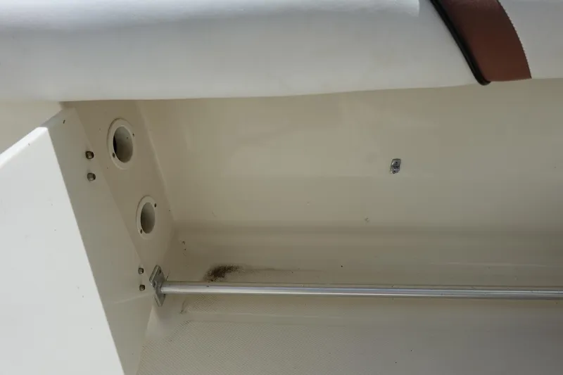 Slide: The Image of 2005 Hydra-Sports Vector 3300 CC interior detail with rod holder and storage compartment. - 23