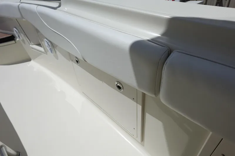 Slide: The Image of 2005 Hydra-Sports Vector 3300 CC boat interior with cushioned seating and storage compartments. - 39