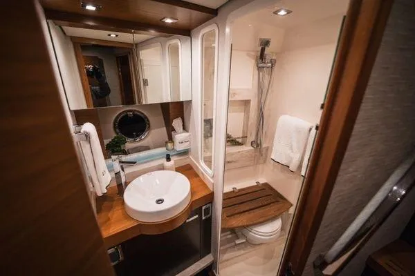 Slide: The Image of Luxurious bathroom in 2016 Tiara Yachts C44 Coupe, featuring modern fixtures and elegant design. - 12