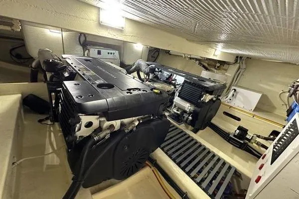 Slide: The Image of Engine room of 2016 Tiara Yachts C44 Coupe with dual engines and mechanical systems. - 20