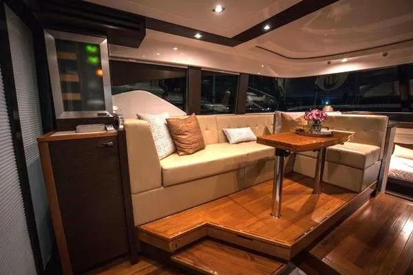 Slide: The Image of Luxurious interior of 2016 Tiara Yachts C44 Coupe with elegant seating and wooden accents. - 5