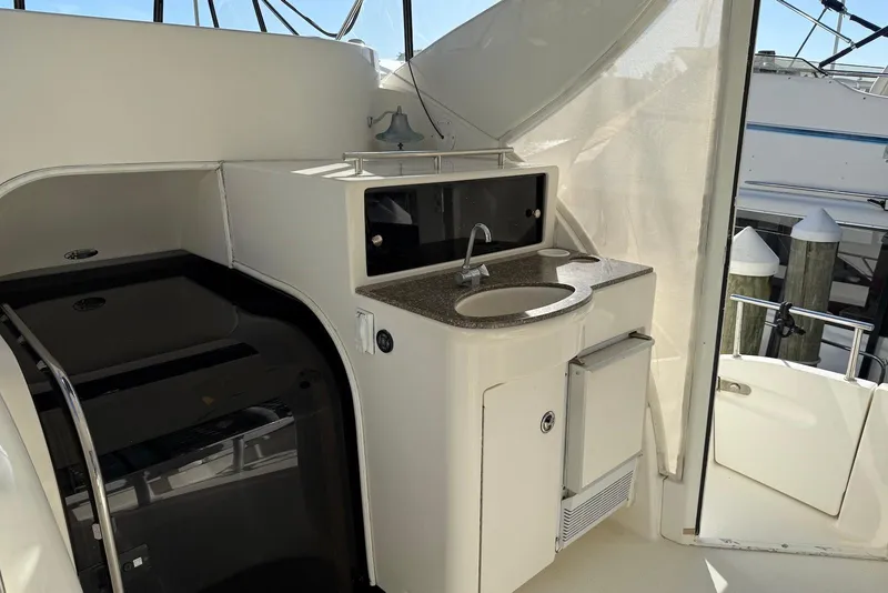 Slide: The Image of 2005 Meridian 459 Motoryacht interior with sink and storage area. - 10