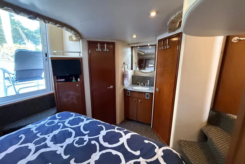Slide: The Image of Luxurious 2005 Meridian 459 Motoryacht interior with cozy bedroom and modern amenities. - 32