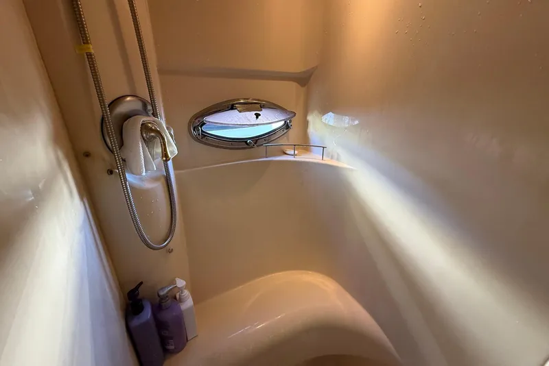 Slide: The Image of Shower area in 2005 Meridian 459 Motoryacht with porthole and toiletries. - 34