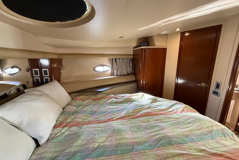 Slide: The Image of Luxurious bedroom interior of 2005 Meridian 459 Motoryacht with cozy bedding and wooden accents. - 36