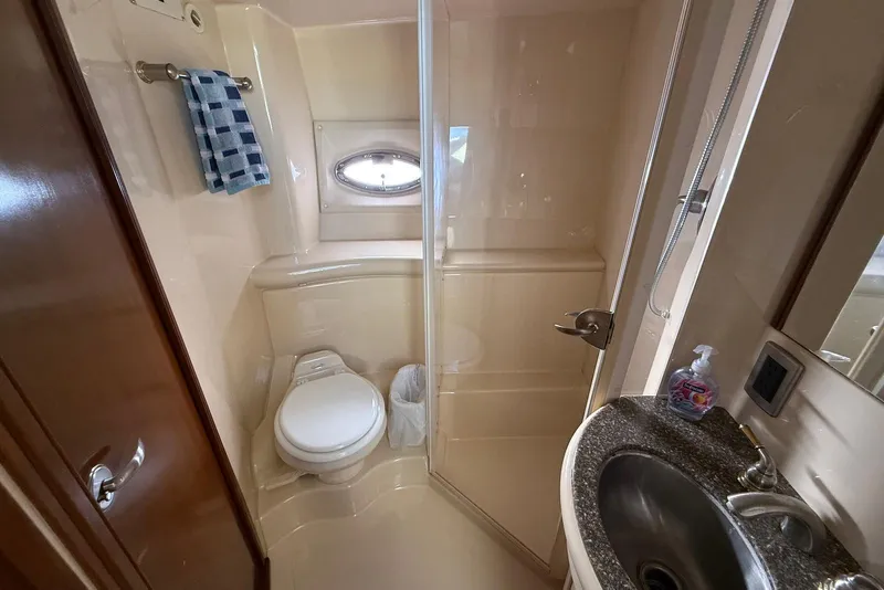 Slide: The Image of 2005 Meridian 459 Motoryacht bathroom with shower, sink, and toilet. - 38