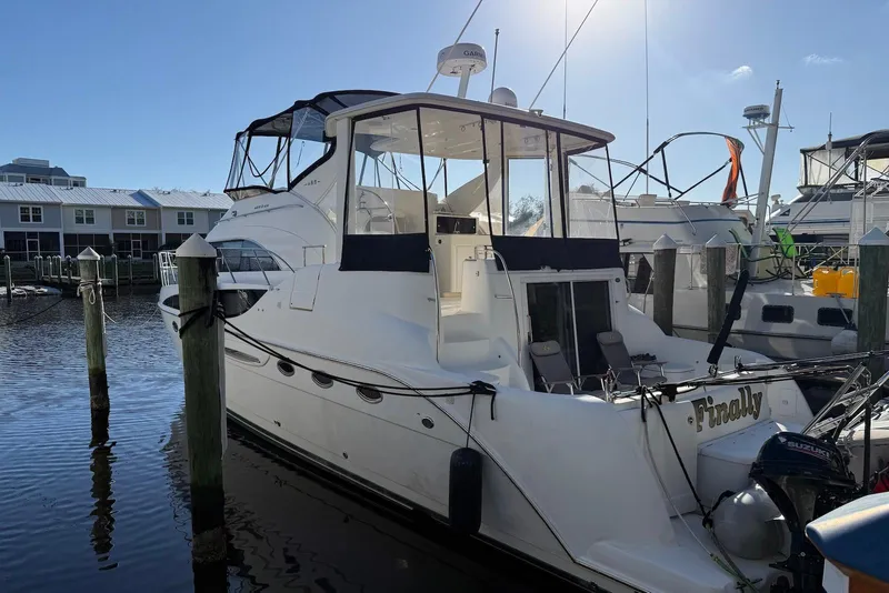 Slide: The Image of 2005 Meridian 459 Motoryacht docked at marina under clear blue sky. - 4