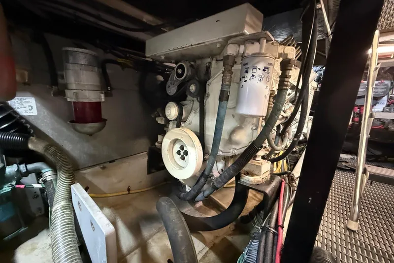 Slide: The Image of Engine room of 2005 Meridian 459 Motoryacht, showcasing mechanical components and wiring. - 42