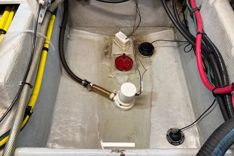 Slide: The Image of Bilge area of 2005 Meridian 459 Motoryacht with wiring and pump components. - 44
