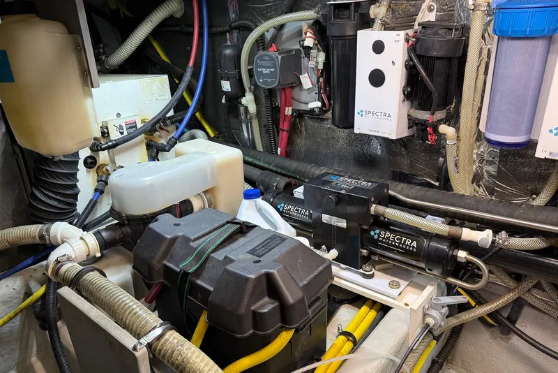 Slide: The Image of Engine room of 2005 Meridian 459 Motoryacht with Spectra watermakers and various equipment. - 46
