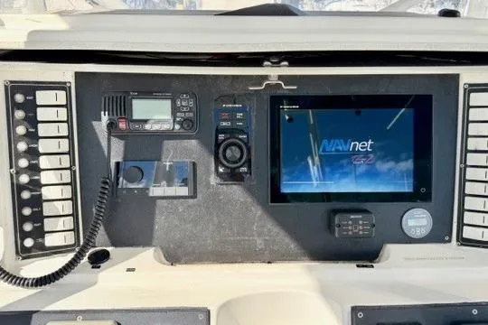 Slide: The Image of Control panel of a 1997 Marlin Yachts 350SF with navigation and communication equipment. - 12