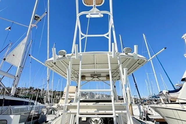 Slide: The Image of 1997 Marlin Yachts 350SF boat tower with clear blue sky background. - 15