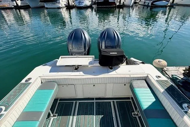 Slide: The Image of 1997 Marlin Yachts 350SF with twin engines docked at a marina. - 17