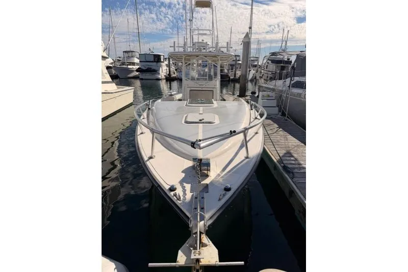 Slide: The Image of 1997 Marlin Yachts 350SF docked at marina under blue sky. - 3