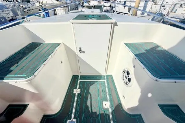 Slide: The Image of 1997 Marlin Yachts 350SF boat interior with teal accents and seating. - 6