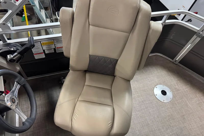 Slide: The Image of 2024 Sun Tracker Fishin' Barge 20 DLX captain's chair and steering wheel detail. - 14