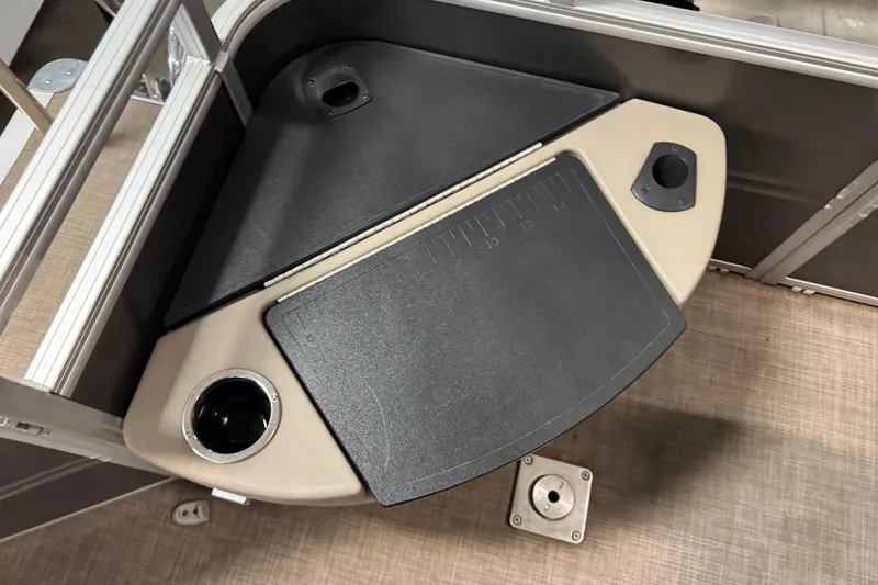 Slide: The Image of 2024 Sun Tracker Fishin' Barge 20 DLX fishing station with cup holders and measuring board. - 20