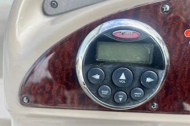 Slide: The Image of Control panel of a 2006 Sea Ray Sundancer 260 boat with wood finish. - 8