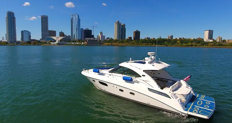 Slide: The Image of Sea Ray 470 Sundancer 2011 yacht cruising near city skyline on a sunny day. - 20